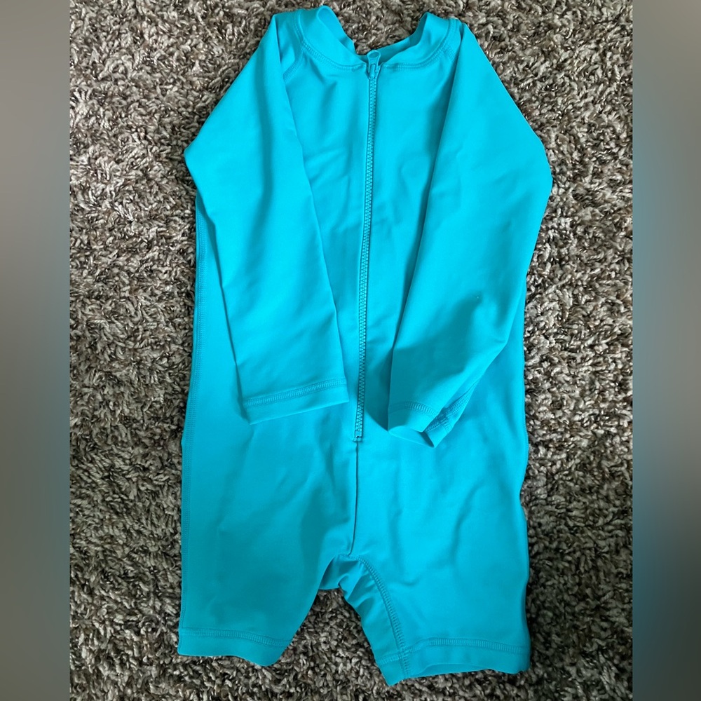 Full coverage swimsuit, size 2T. Long sleeve rash guard.